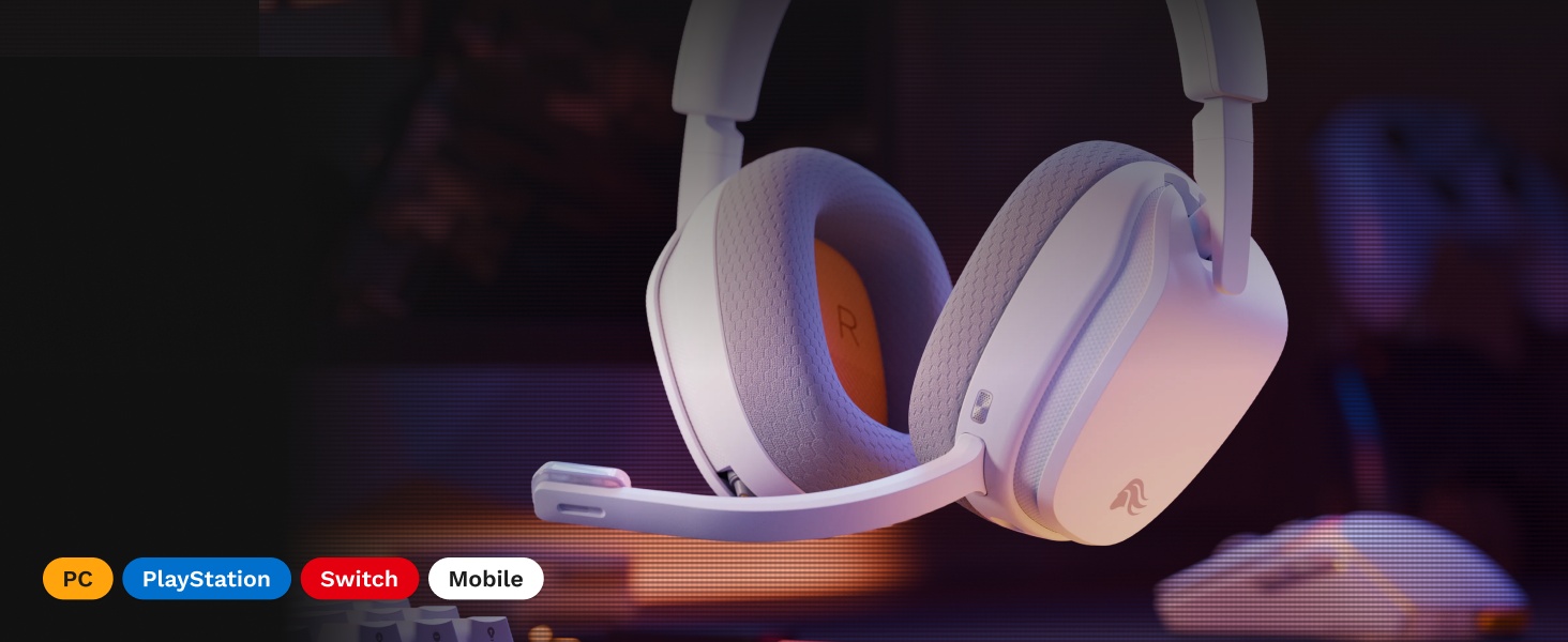 Écouteurs supra-auriculaires sans fil avec rembourrage dégradé violet/rose et logos visibles de la marque, y compris JBL, affichés sur fond éclairé.