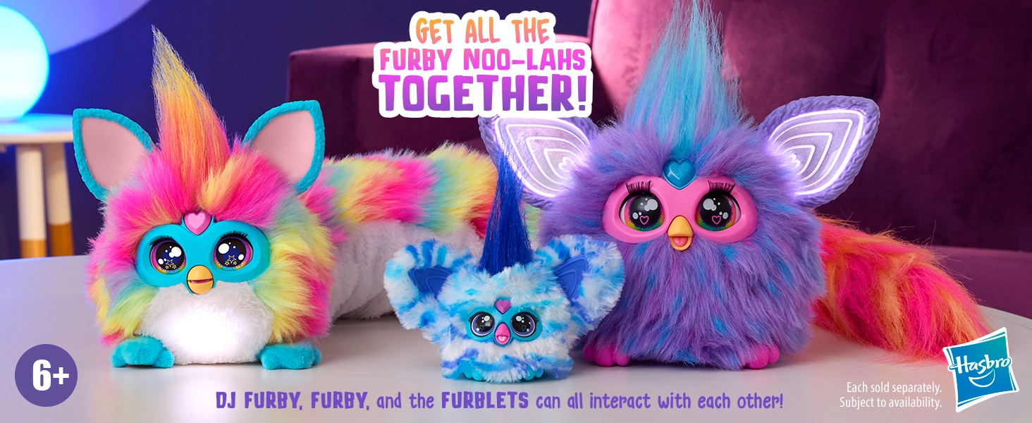 Text reads 'FURBY FURBLETS'. Colorful interactive plush toys featuring bright fur in pink, blue, and purple with large eyes and distinctive Furby design elements.