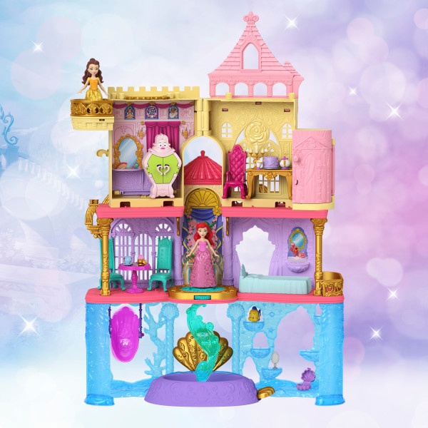 Colorful children's dollhouse with multiple levels featuring pink towers, yellow walls, and underwater-themed base level with purple and blue accents.